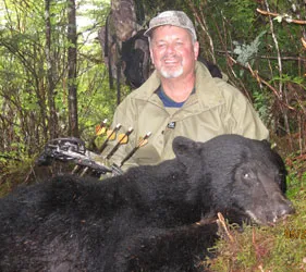 Hunter with a harvested black bear
