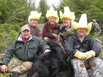Hunter with a harvested black bear