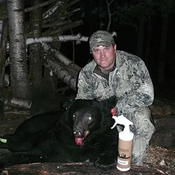 Hunter with a harvested black bear