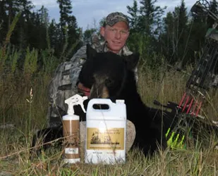 Hunter with a harvested black bear
