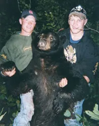 Hunter with a harvested black bear