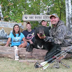 Hunter with a harvested black bear