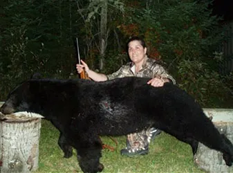 Hunter with a harvested black bear