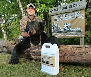 Hunter with a harvested black bear