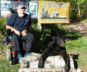 Hunter with a harvested black bear