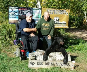 Hunter with a harvested black bear
