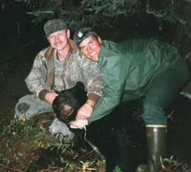 Hunter with a harvested black bear