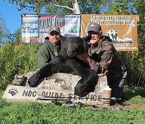Hunter with a harvested black bear