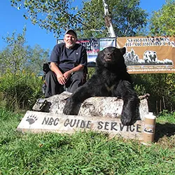 Hunter with a harvested black bear