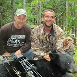 Hunter with a harvested black bear