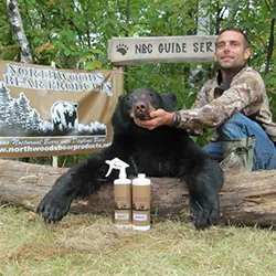 Hunter with a harvested black bear