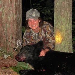 Hunter with a harvested black bear
