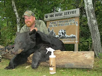 Hunter with a harvested black bear