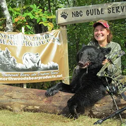 Hunter with a harvested black bear