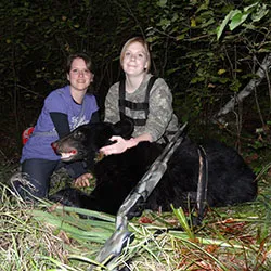 Hunter with a harvested black bear