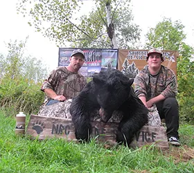 Hunter with a harvested black bear