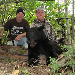 Hunter with a harvested black bear