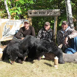 Hunter with a harvested black bear