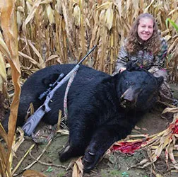 Hunter with a harvested black bear