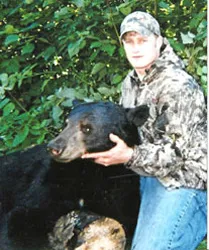 Hunter with a harvested black bear