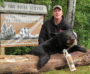 Hunter with a harvested black bear