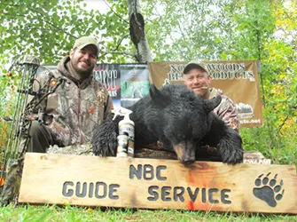 Hunter with a harvested black bear
