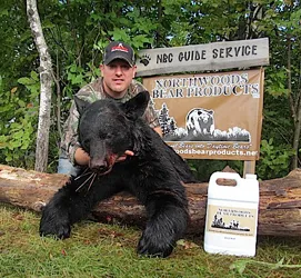 Hunter with a harvested black bear