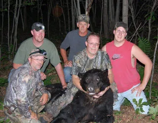 Hunter with a harvested black bear