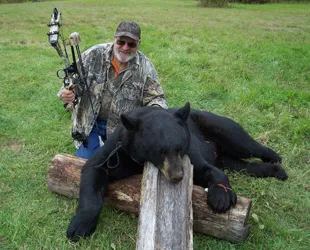 Hunter with a harvested black bear