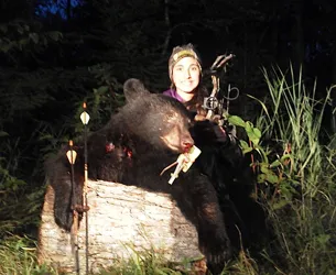 Hunter with a harvested black bear