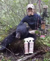 Hunter with a harvested black bear