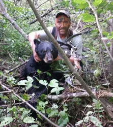 Hunter with a harvested black bear