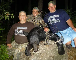 Hunter with a harvested black bear
