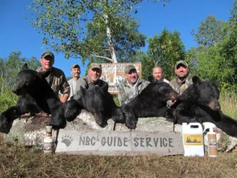 Hunter with a harvested black bear