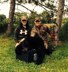 Hunter with a harvested black bear