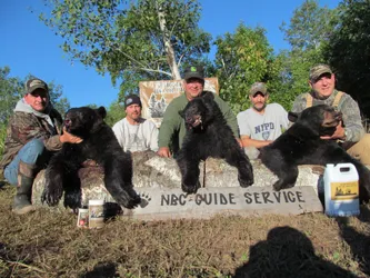 Hunter with a harvested black bear