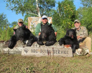 Hunter with a harvested black bear