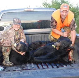 Hunter with a harvested black bear