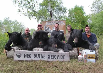 Hunter with a harvested black bear