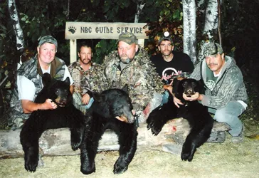 Hunter with a harvested black bear