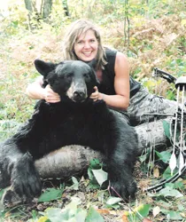 Hunter with a harvested black bear