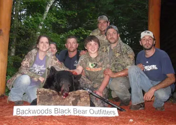 Hunter with a harvested black bear