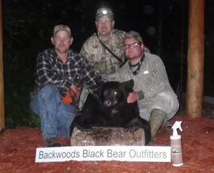 Hunter with a harvested black bear