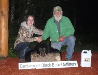 Hunter with a harvested black bear