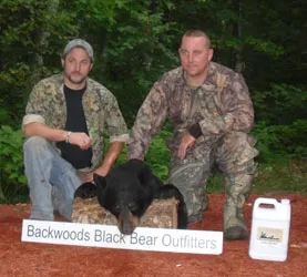 Hunter with a harvested black bear