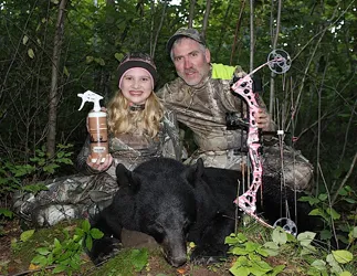 Hunter with a harvested black bear