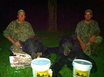 Hunter with a harvested black bear