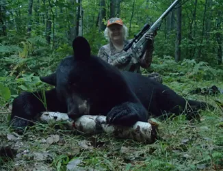 My 2014 Bear from Bayfield, Wisconsin. 50 yards with CVA 50 cal. 1 shot. He seemed to like the butterscotch!!