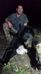 Hunter with a harvested black bear