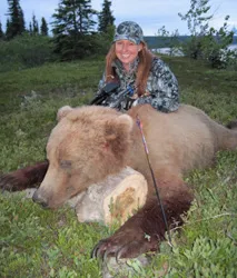 Hunter with a harvested black bear